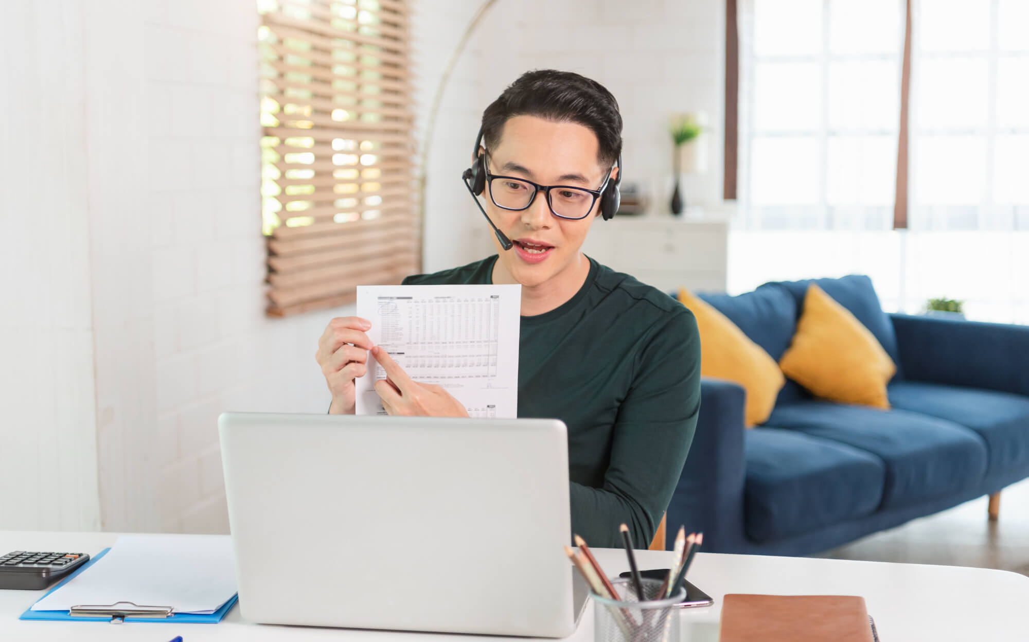 Financial expert assisting clients over the phone at Gill Financial Inc.