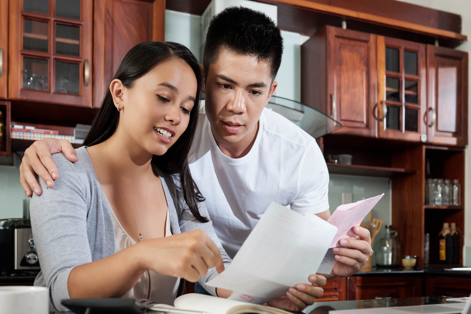 Couple discussing personalized loan solutions with Gill Financial Inc.